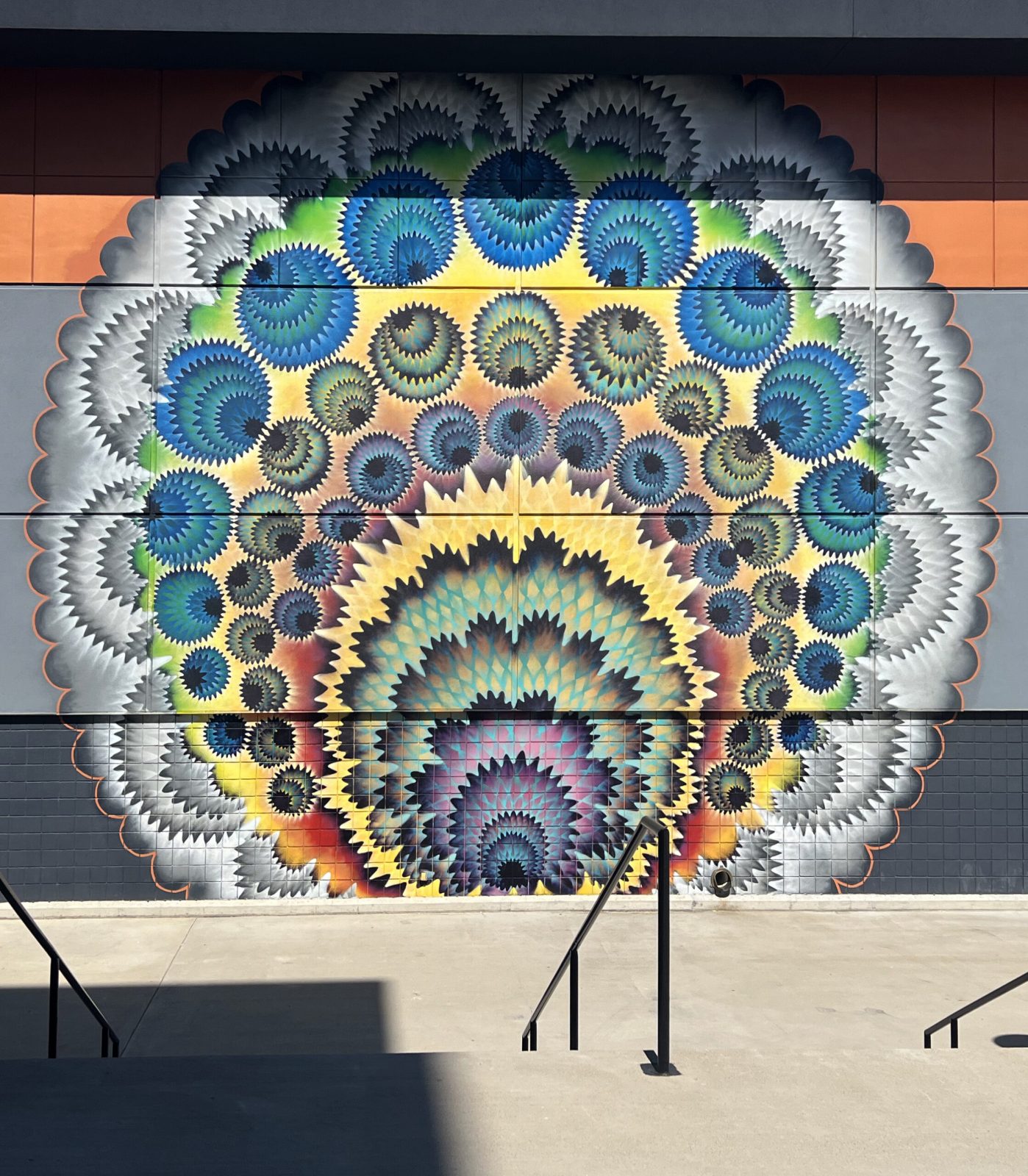 A vibrant wall art nearby alongside a sidewalk in Cincinnati, OH