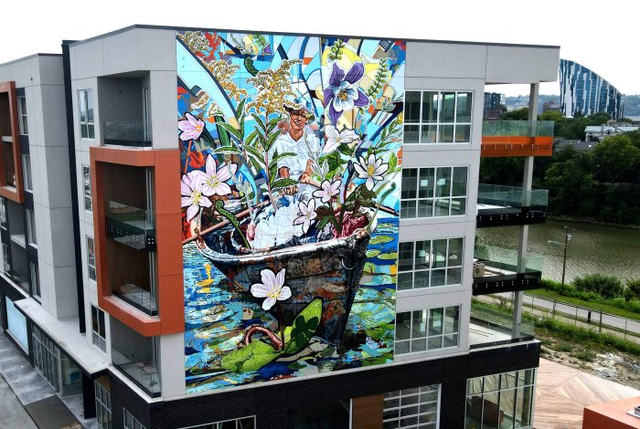 A striking mural featuring blooming flowers on a Cincinnati, OH