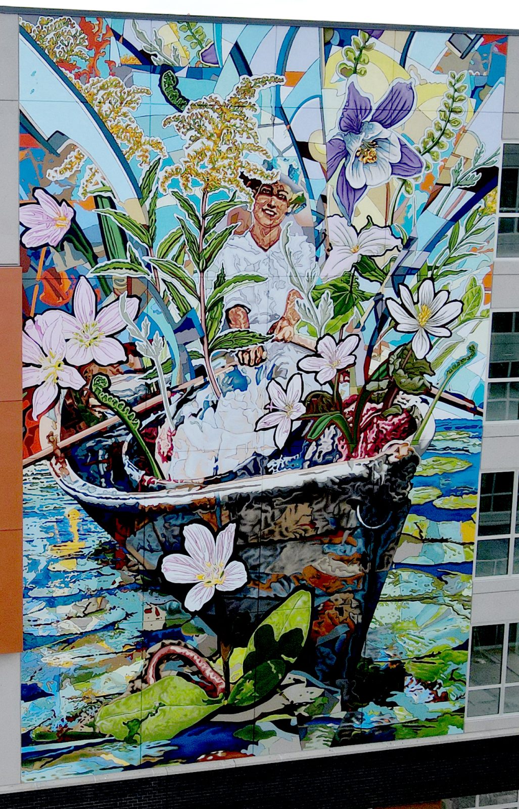 A large artwork featuring a woman in a flower-adorned boat, displayed in Cincinnati, OH